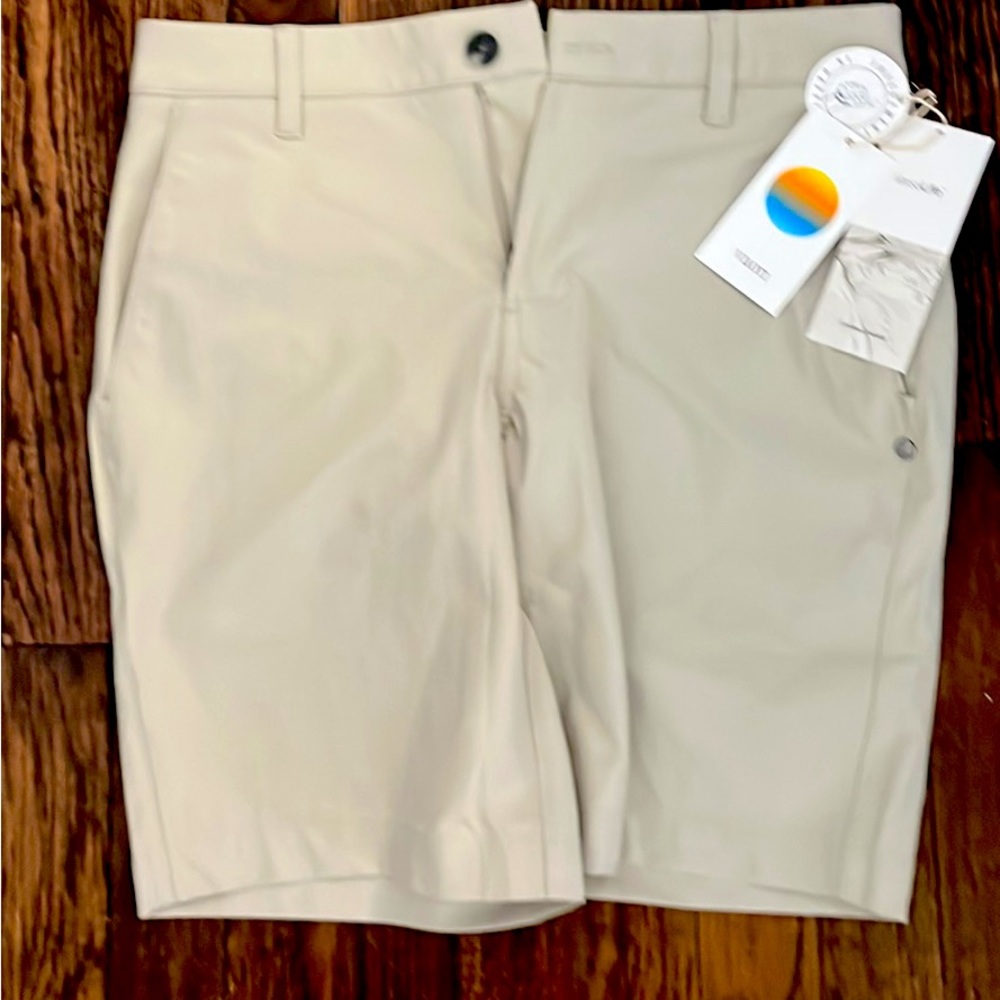 Vuori men’s light khaki shorts.  New with tags. 28.